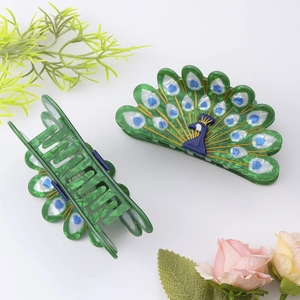 Peacock shaped acetate hair claw clips with green marble pattern and blue feather details