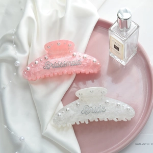 Elegant large bridal hair claws in pink and white marble with pearls and script