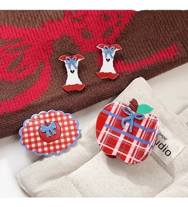 Detailed set of red and white checkered apple hair clips with cute blue bows