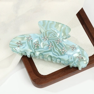 Elegant light blue marble acetate hair claw clip with crystal flower patterns for women