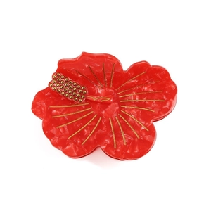 Elegant red hibiscus hair claw clip with marble texture and golden stamen detail