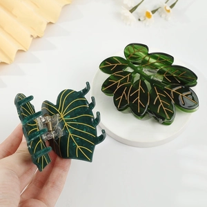 Pinces à cheveux en acétate motif feuilles de Monstera vertes avec nervures dorées