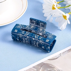 Navy blue paisley pattern hair claw clip with vintage resin finish for elegant hair styling