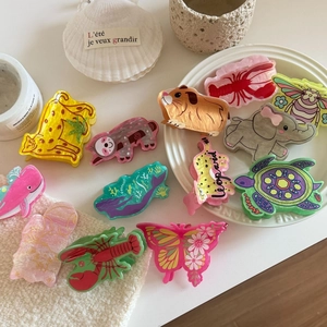 Cute animal acrylic hair claws including leopard, elephant and whale shapes on white background