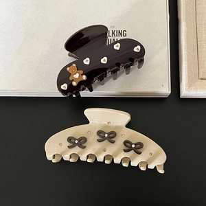 Elegant brown hair claw clips with bow and bear accents featuring sparkling rhinestones