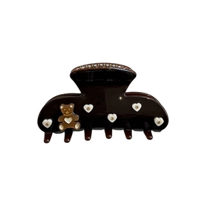 Brown acetate hair claw clip featuring a 3D bear and sparkling rhinestone hearts