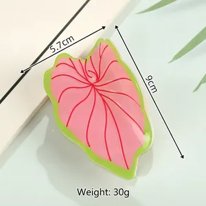 Detail view of pink leaf hair claw clip with size dimensions 9cm by 5.7cm shown