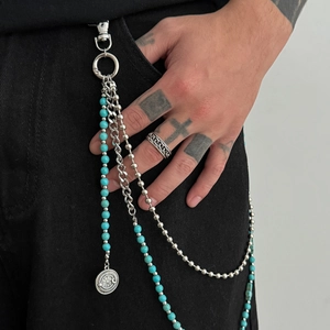 Men's hip hop waist chain with turquoise beads and cross pendants on black jeans