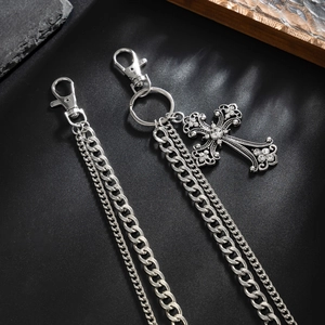 Detail of silver double layered metal pant chain with rhinestone cross pendant charm
