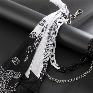 Close-up of hip-hop paisley bandana and industrial chain accessory for street fashion
