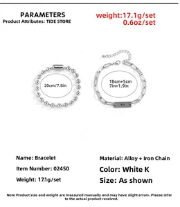 Detail showing two-piece silver chain bracelet set with bead and paperclip links