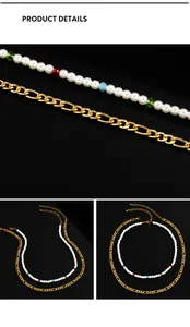 Detail of layered gold Figaro chain and white pearl necklace with colorful beads