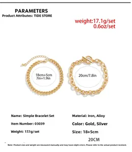 Detail view of gold-tone double layer chain bracelet set with toggle clasp and lobster hook