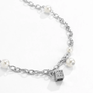 Men's fashion necklace with white pearls and silver chain featuring a dice pendant charm