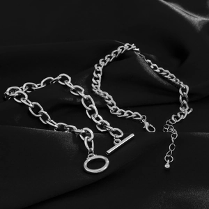 Detail view of double-layered stainless steel chains with OT buckle on black silk