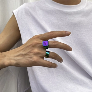 Detail view of iridescent square signet ring set and minimalist round band for men