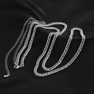 Detailed macro view of silver punk body chain with metal lobster clasp and adjustable links