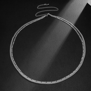 Detailed macro view of silver double-layered hip chain with adjustable lobster clasp