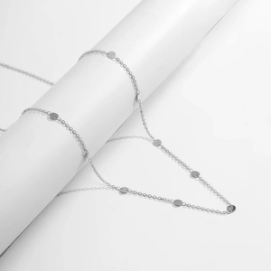 Minimalist silver metal waist chain with hollow sequins for a punk geometric body link look