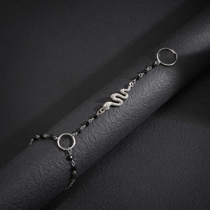 Silver snake bracelet with black crystal beads and finger ring in Gothic style