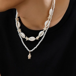 Collier double rang en perles de coquillage et tortue pour homme style bohème chic