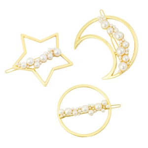 Detailed view of three gold alloy hair clips featuring star, moon, and circle with pearls