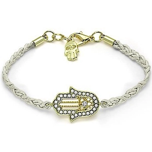 Detailed macro view of woven Hamsa Hand bracelet with golden finish and crystal inlay