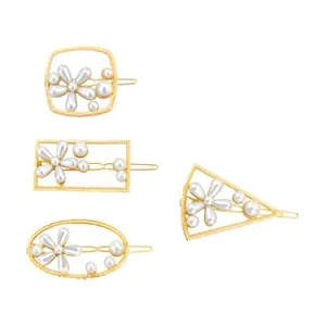 Detail view of 5-piece gold alloy geometric hair clips with white faux pearl flower patterns