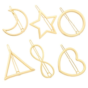Detailed set of six gold-colored geometric hair clips in moon star and heart shapes