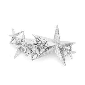 Detailed macro view of silver star hair clip showing hammered metal texture and spring clasp