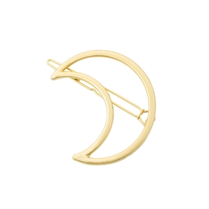 Close-up of a minimalist hollow crescent moon hair clip in a polished gold finish