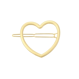 Close-up of minimalist hollow heart-shaped metal hair clip in matte gold finish