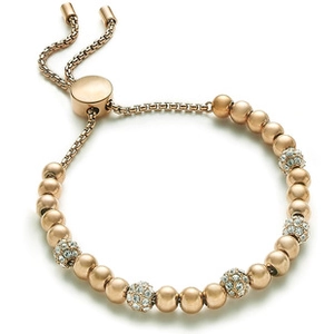 Detail of rose gold box chain bracelet with pave-set zircon spheres and slider bolo clasp