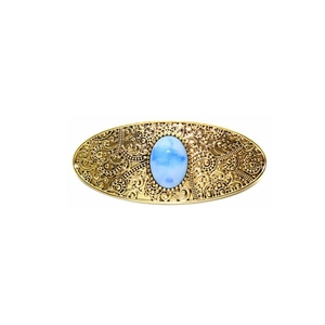 Vintage gold hollow pattern hair clip featuring a central oval sky blue gemstone