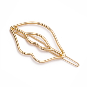 Minimalist golden hollow lip shaped metal hair clip with a sleek geometric alloy design