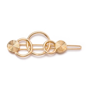 Minimalist gold alloy geometric hair clip with interlocking circular rings and textured discs