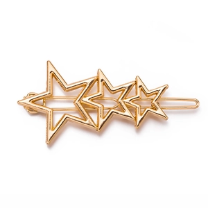 Gold star alloy hair clip with three overlapping stars in minimalist geometric style