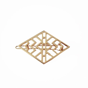Detailed close-up of rose gold geometric hollow rhombus hair clip in minimalist style