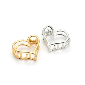 Minimalist hollow heart-shaped metal hair claw clips in polished gold and silver finish