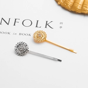 Set of two gold and silver geometric sunflower hair clips with sparkling center rhinestones
