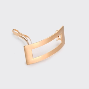 Minimalist rectangular gold brushed metal hair clip with secure spring fastener