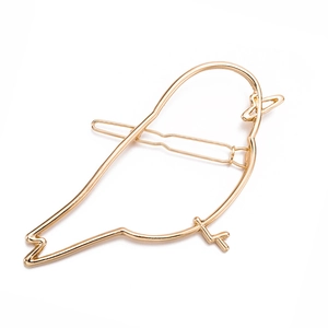Minimalist golden bird alloy hair clip with a sleek metal silhouette on a white background
