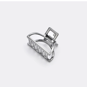 Detailed view of polished silver geometric semi-circle hair claw clip with strong spring