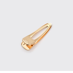 Minimalist gold hollow triangle metal hair clip with brushed finish for women
