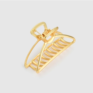 Detail view of the durable metal spring and golden geometric claw clip structure