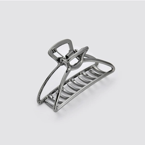 Detail of dark grey metal hair claw clip featuring a durable spring and secure teeth