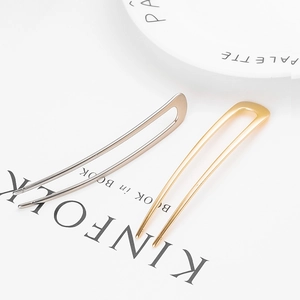 Minimalist U-shaped metal hairpins in gold and silver finish for elegant hair styling