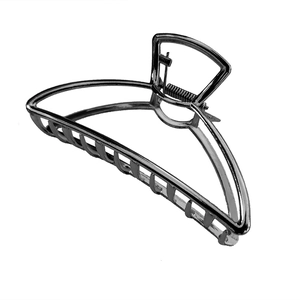 Detailed view of large metal hair claw clip with silver polished finish and strong spring