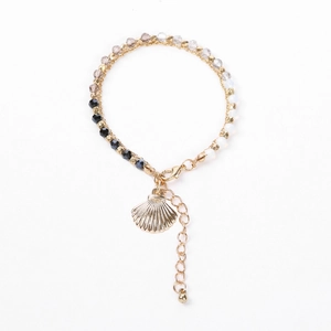 Bracelet multicouche en perles avec breloques coquillages dorés et cristaux facettés