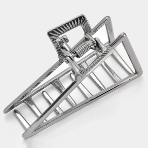 Detail of silver hollow geometric triangle hair claw clip with strong metal spring